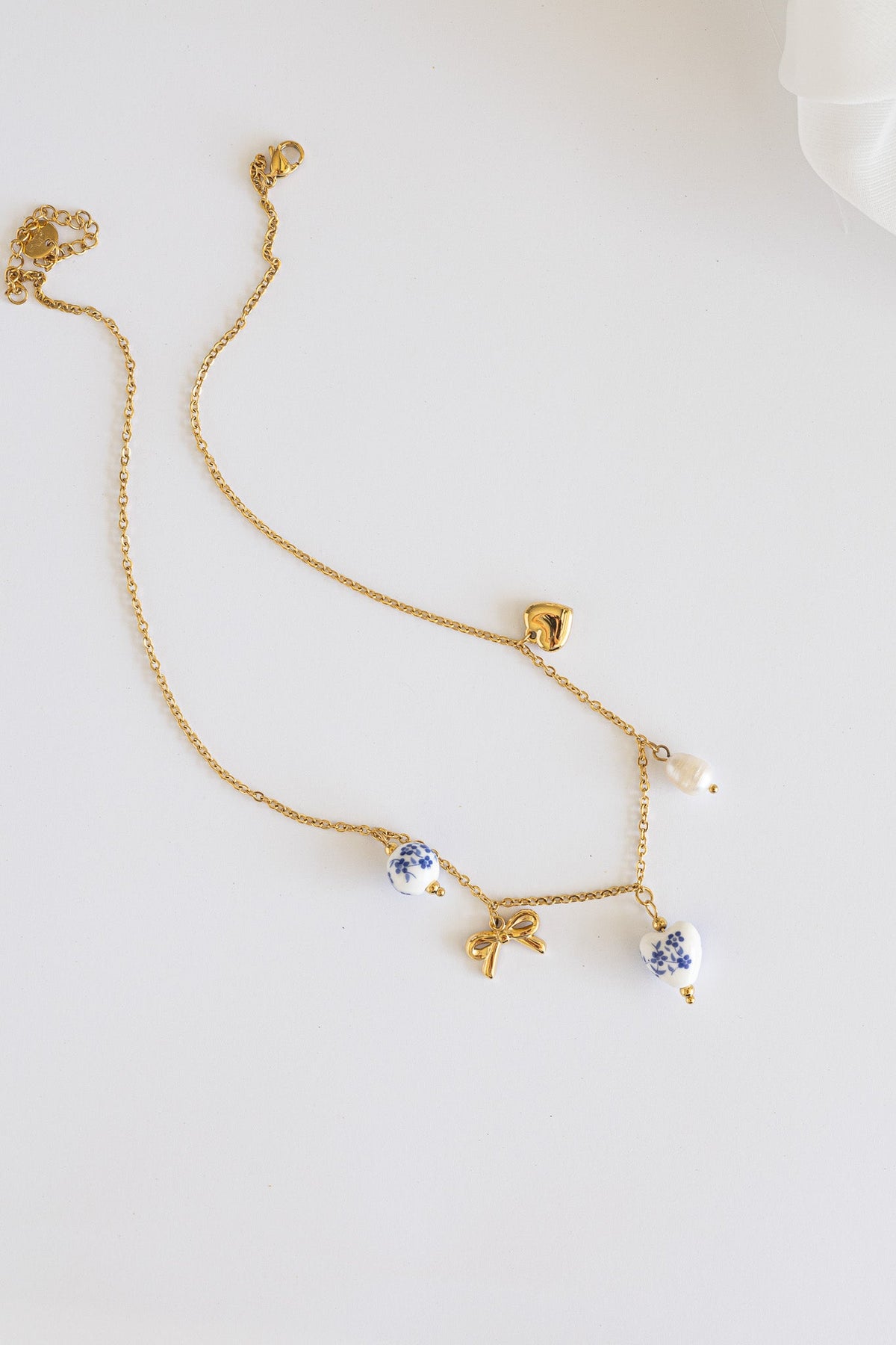 Bella Charm Necklace in Blue by Rose & Clay
