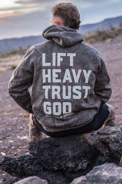 Lift Heavy. Trust God. - Premium Darkwood Camo Hoodie by Tango Charlie Apparel