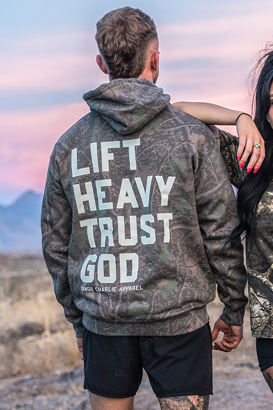 Lift Heavy. Trust God. - Premium Darkwood Camo Hoodie by Tango Charlie Apparel