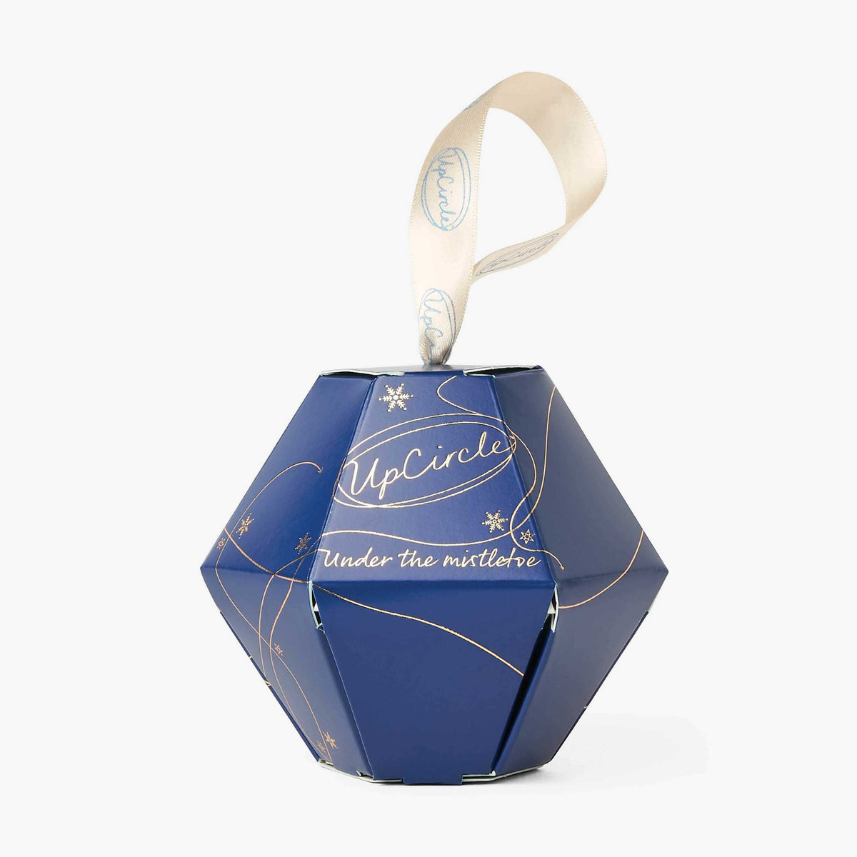 UpCircle Under the Mistletoe lip balm bauble in a Christmas setting