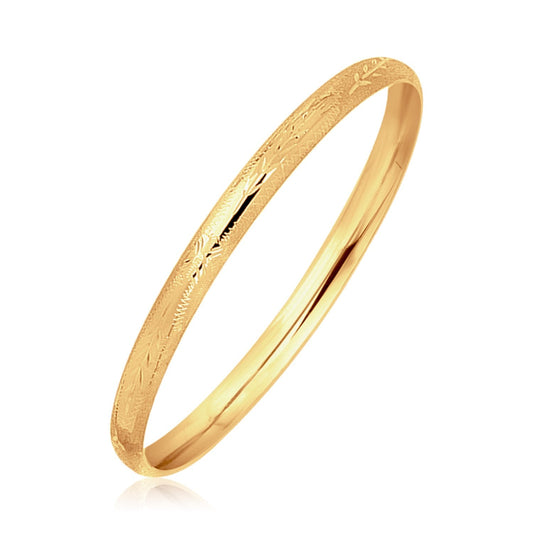 Children's 14k yellow gold dome bangle with diamond cuts by Avera Group
