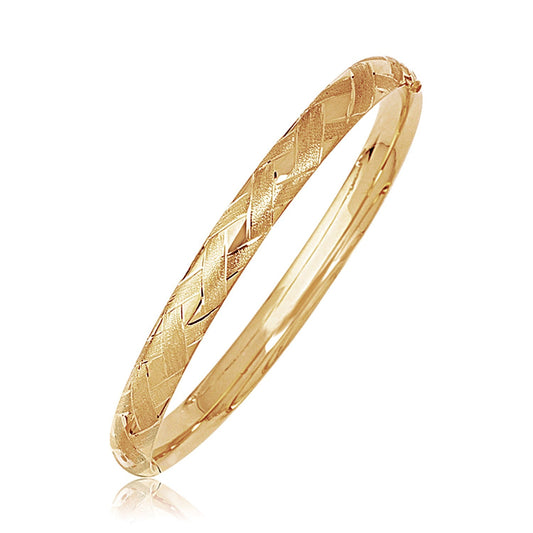 14k yellow gold domed bangle with textured weave motif by Avera Group