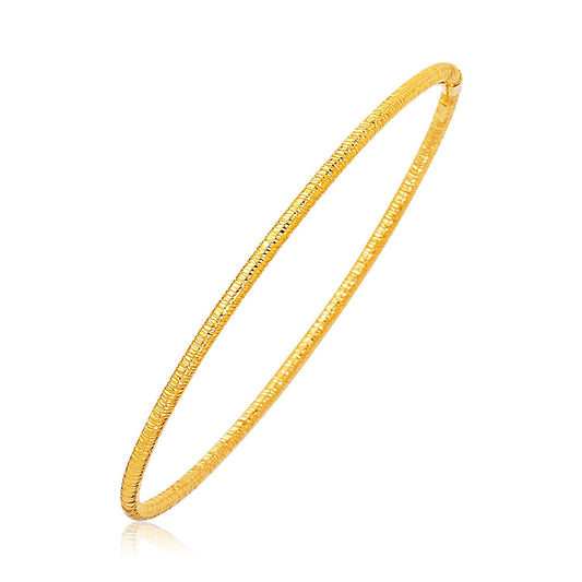 14k yellow gold textured stackable bangle, 3mm by Avera Group