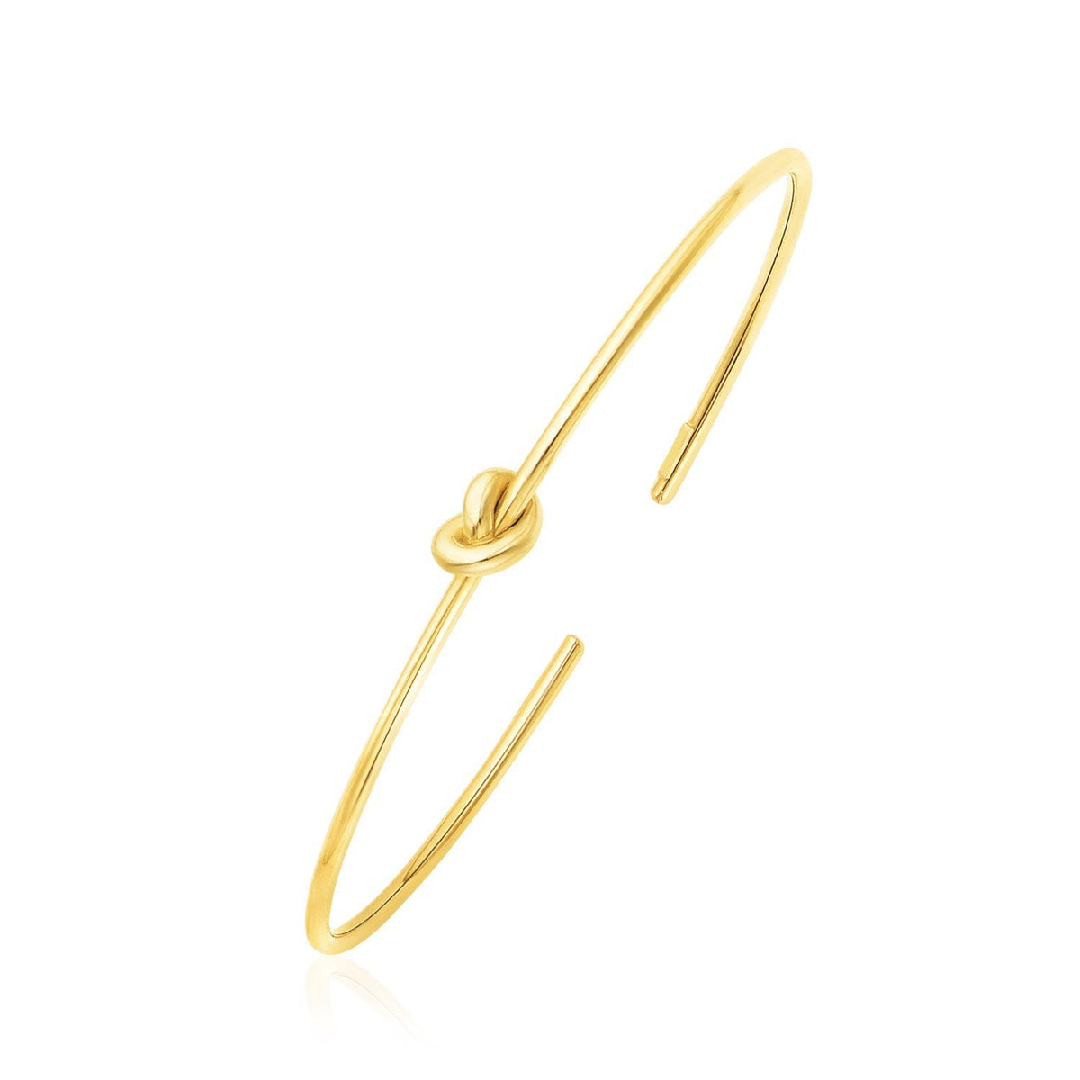 14k yellow gold polished cuff bangle with knot by Avera Group