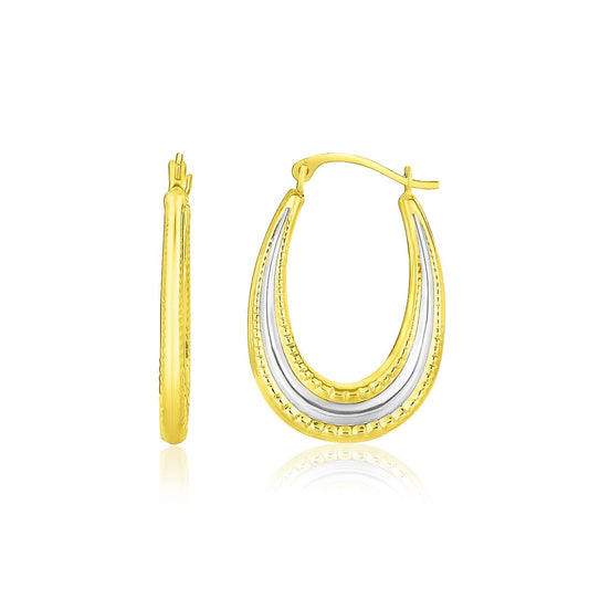 Avera Group 10K two-tone gold graduated oval hoop earrings with center cut