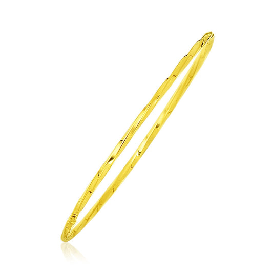 14k yellow gold thin twisted slip-on bangle by Avera Group