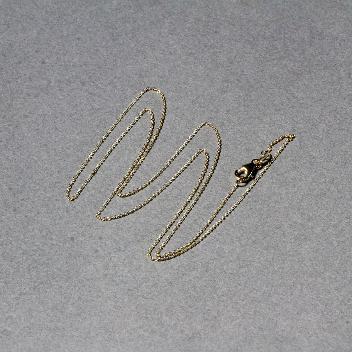 14k yellow gold oval cable link chain, 0.85mm by Avera Group, view 5