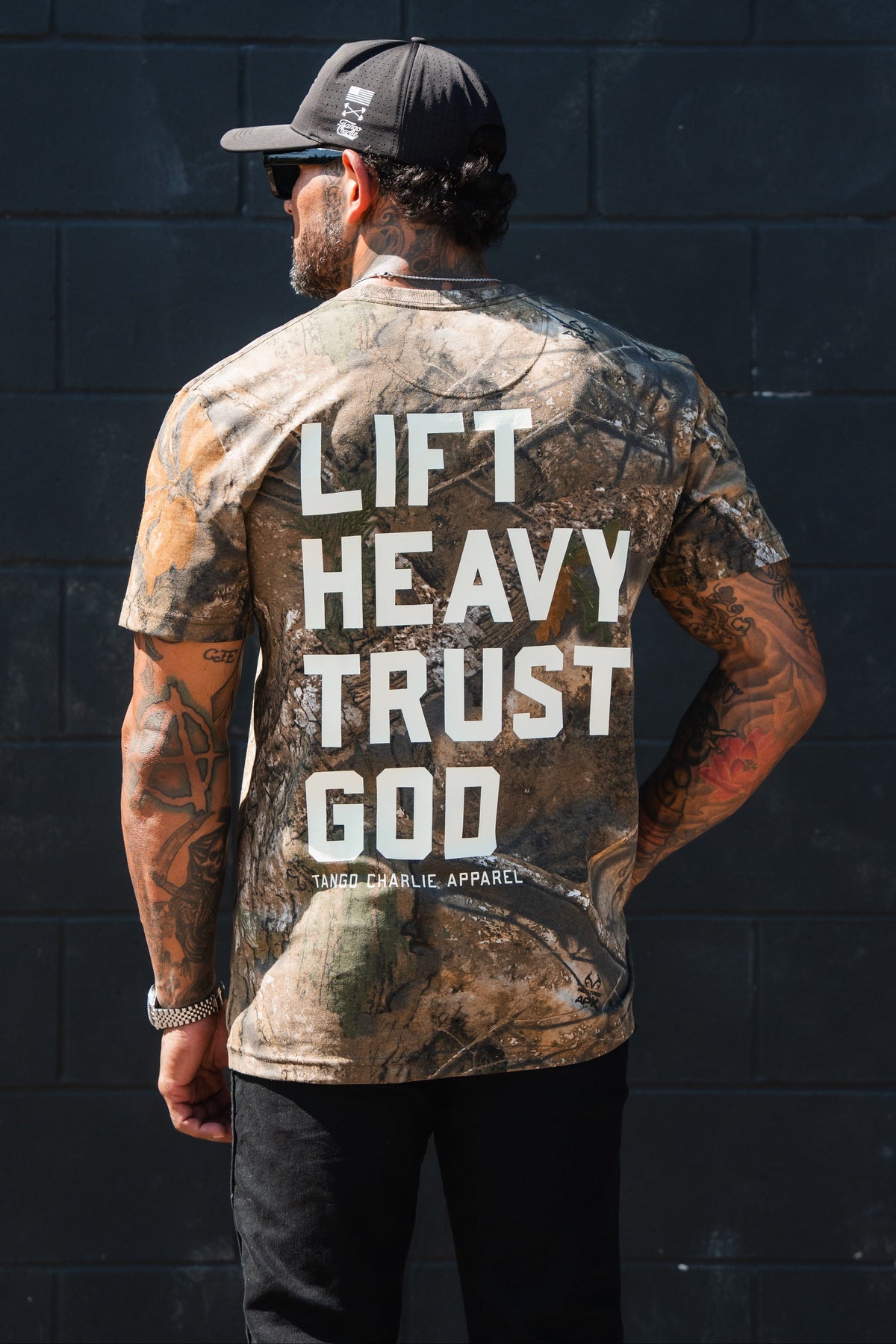 Lift Heavy. Trust God. - Realtree Premium Camo Tee by Tango Charlie Apparel