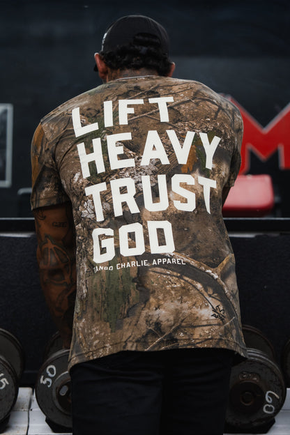 Lift Heavy. Trust God. - Realtree Premium Camo Tee by Tango Charlie Apparel