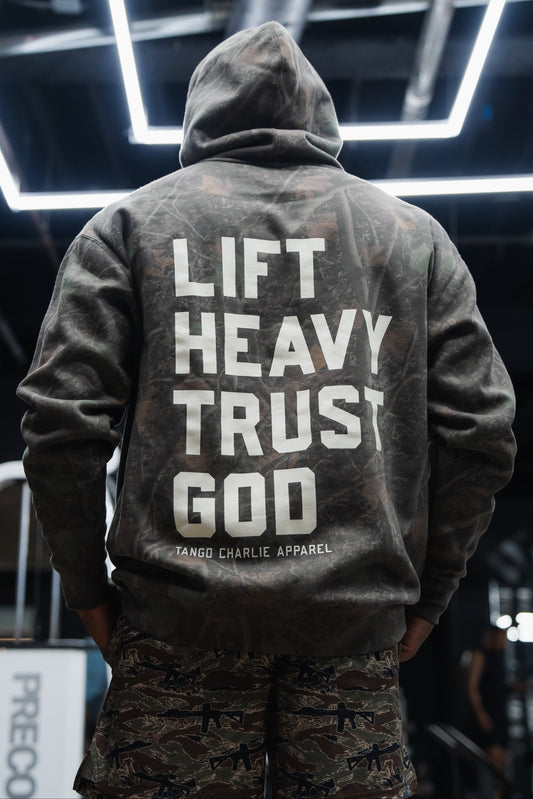 Lift Heavy. Trust God. - Premium Darkwood Camo Hoodie by Tango Charlie Apparel