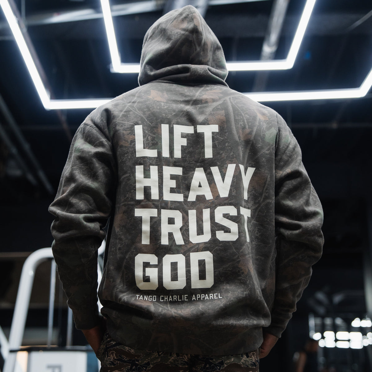 Lift Heavy. Trust God. - Premium Darkwood Camo Hoodie by Tango Charlie Apparel