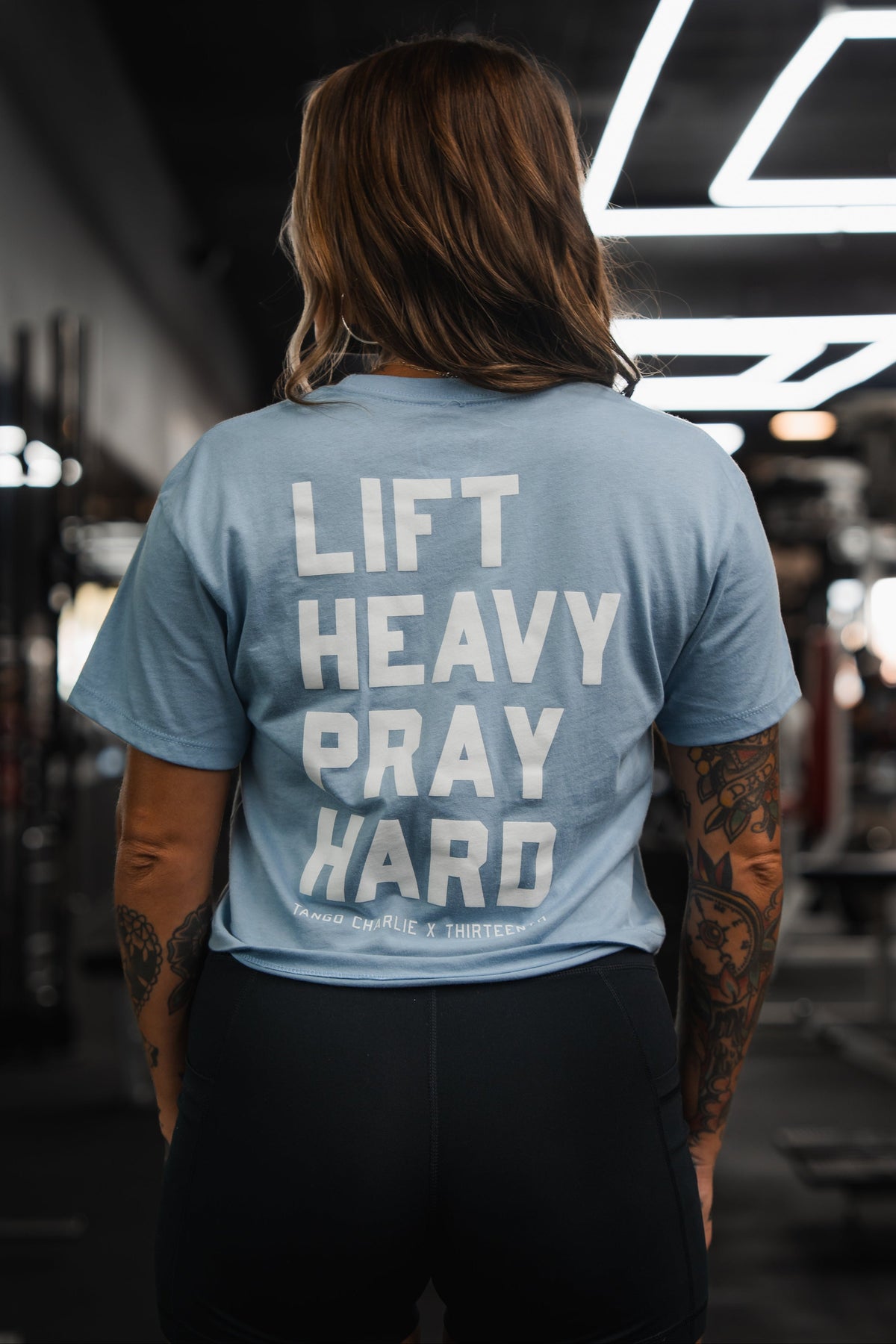 Lift Heavy. Pray Hard. - Baby Blue Women's Crop Tee by Tango Charlie Apparel