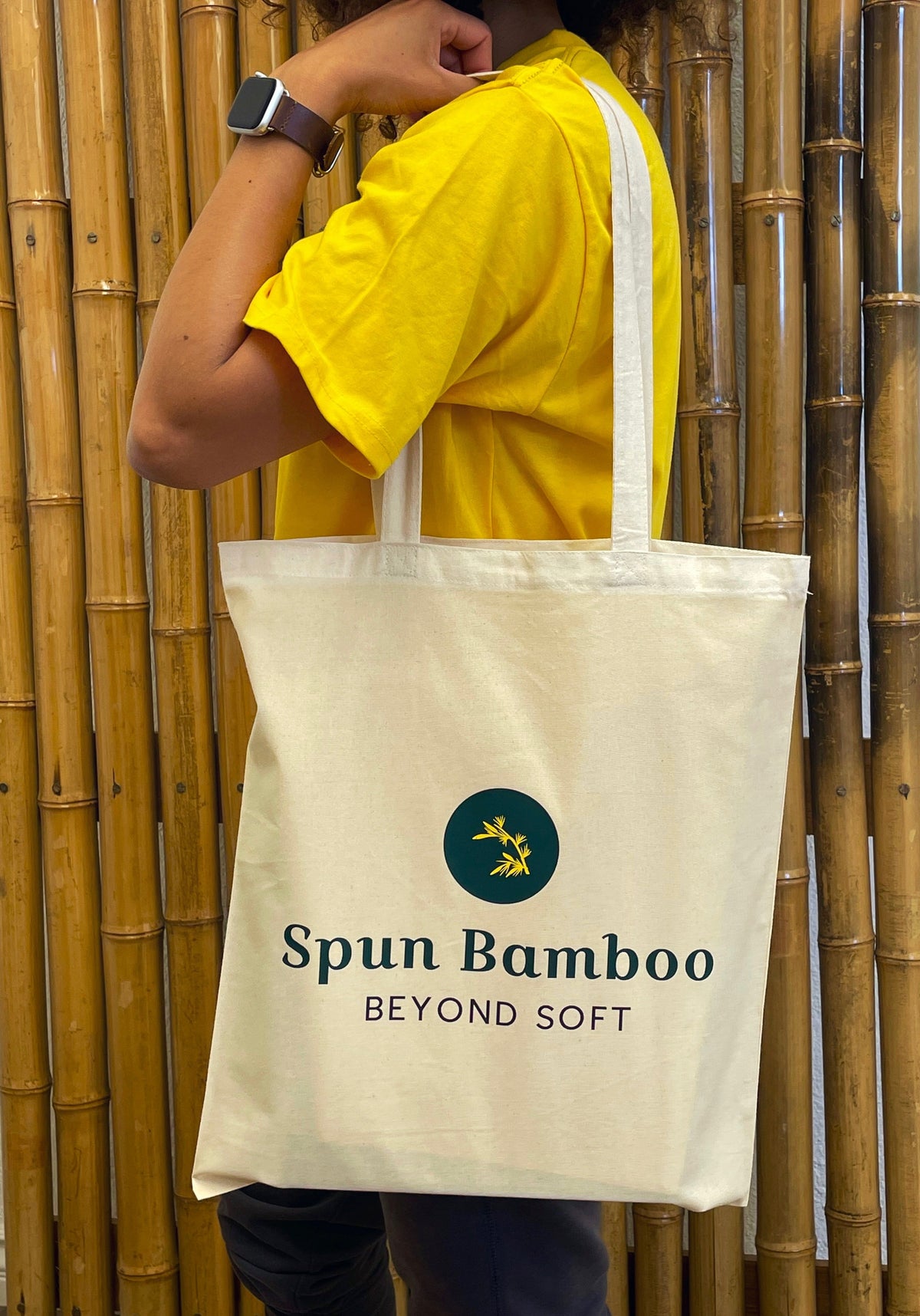 Cotton tote bag with self-fabric handles, sized to fit a 15 inch laptop