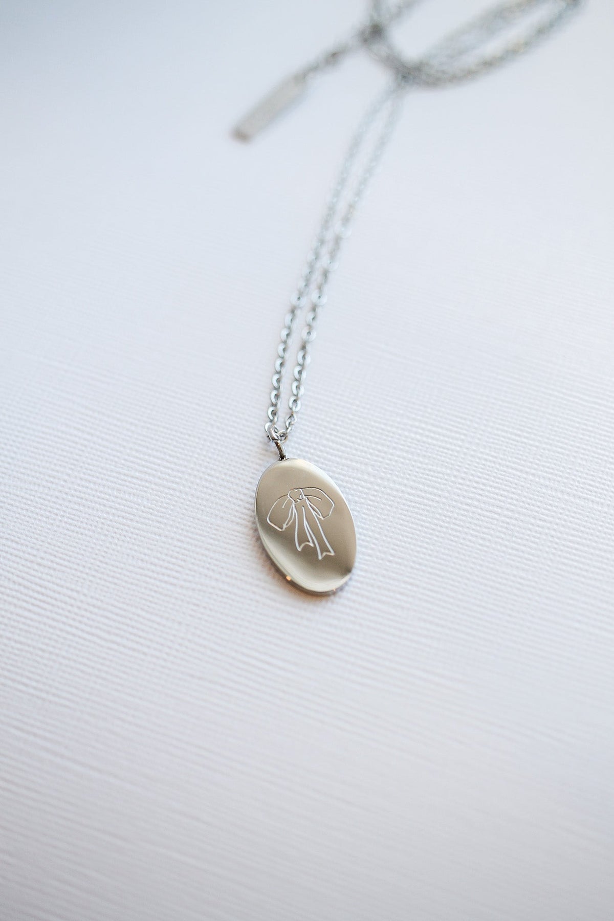 Bow Pendant Necklace by Rose & Clay