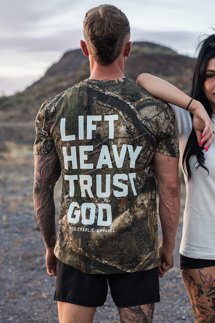 Lift Heavy. Trust God. - Realtree Premium Camo Tee by Tango Charlie Apparel