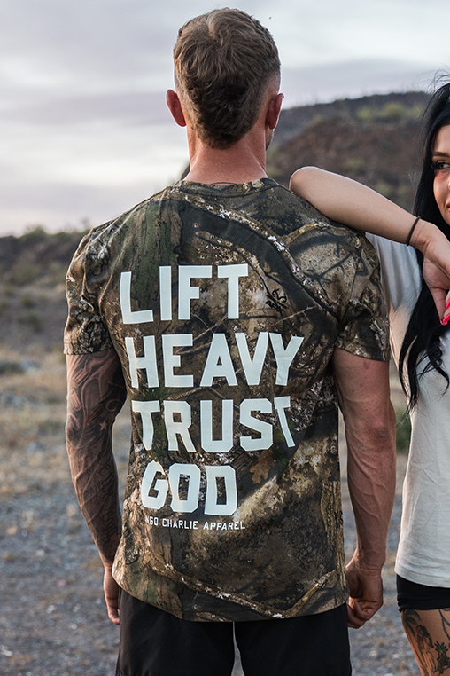 Lift Heavy. Trust God. - Realtree Premium Camo Tee by Tango Charlie Apparel