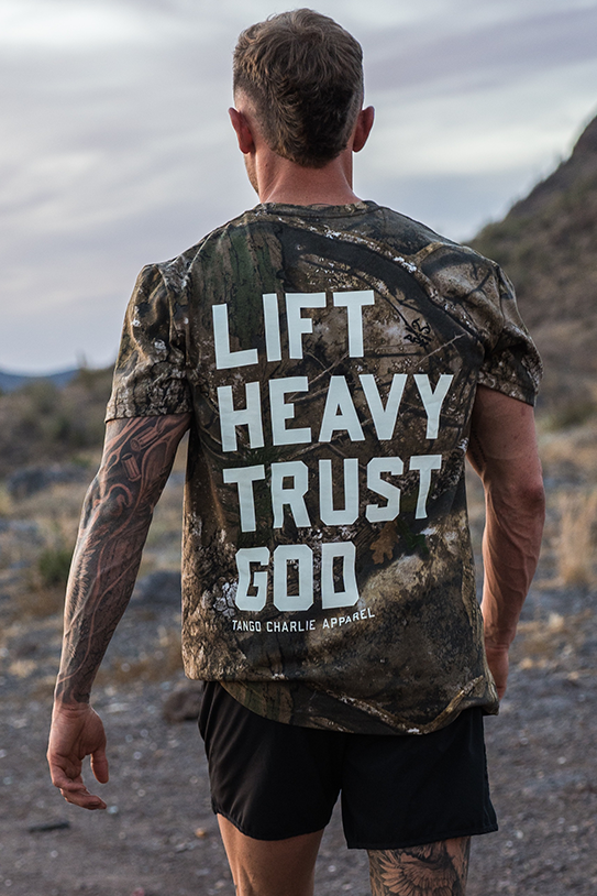 Lift Heavy. Trust God. - Realtree Premium Camo Tee by Tango Charlie Apparel