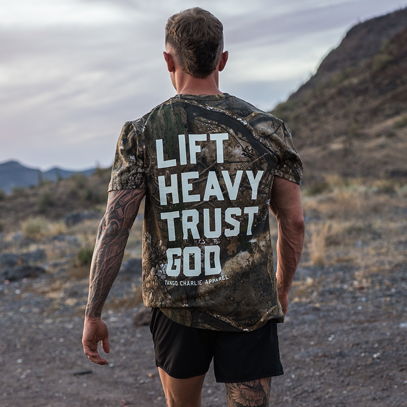 Lift Heavy. Trust God. - Realtree Premium Camo Tee by Tango Charlie Apparel