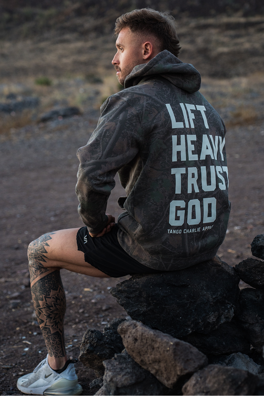 Lift Heavy. Trust God. - Premium Darkwood Camo Hoodie by Tango Charlie Apparel