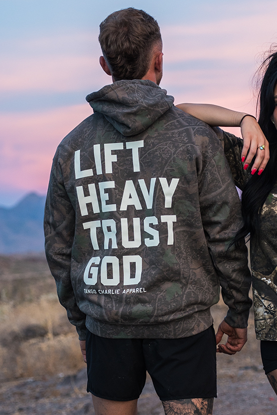 Lift Heavy. Trust God. - Premium Darkwood Camo Hoodie by Tango Charlie Apparel