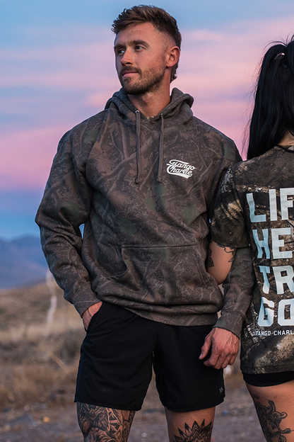 Lift Heavy. Trust God. - Premium Darkwood Camo Hoodie by Tango Charlie Apparel