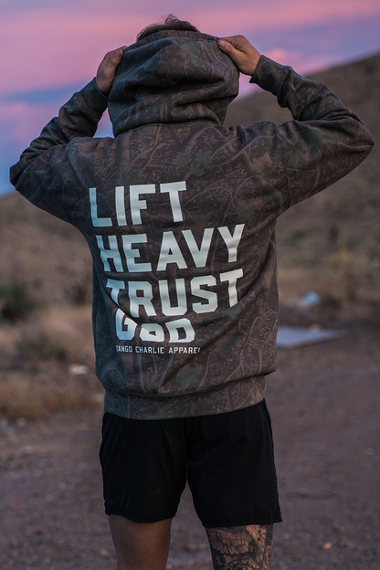 Lift Heavy. Trust God. - Premium Darkwood Camo Hoodie by Tango Charlie Apparel