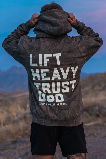 Lift Heavy. Trust God. - Premium Darkwood Camo Hoodie by Tango Charlie Apparel