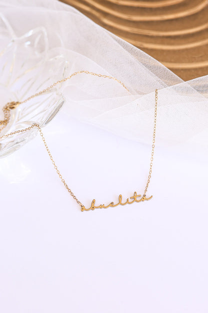 Rose & Clay "Abuelita" cursive script name necklace, gold or silver stainless steel