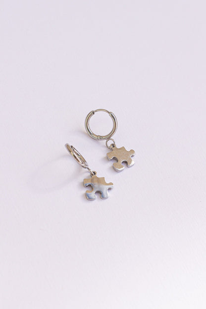 Puzzle Piece Huggie Hoops by Rose & Clay