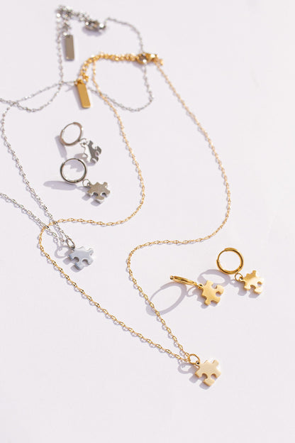 Puzzle Piece Huggie Hoops by Rose & Clay