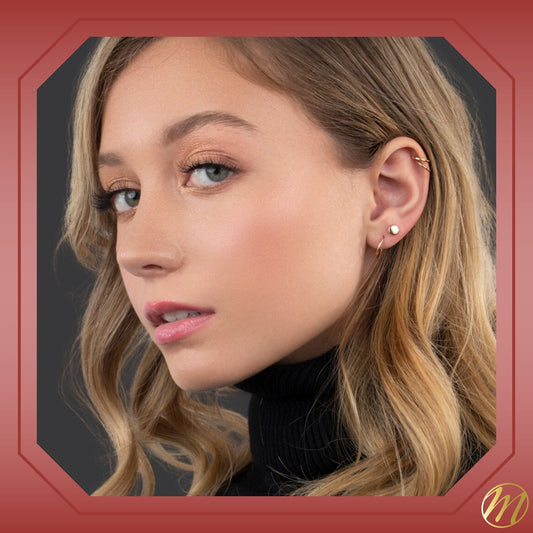 14k yellow gold round button stud earrings by Massete, worn by a model, view 2