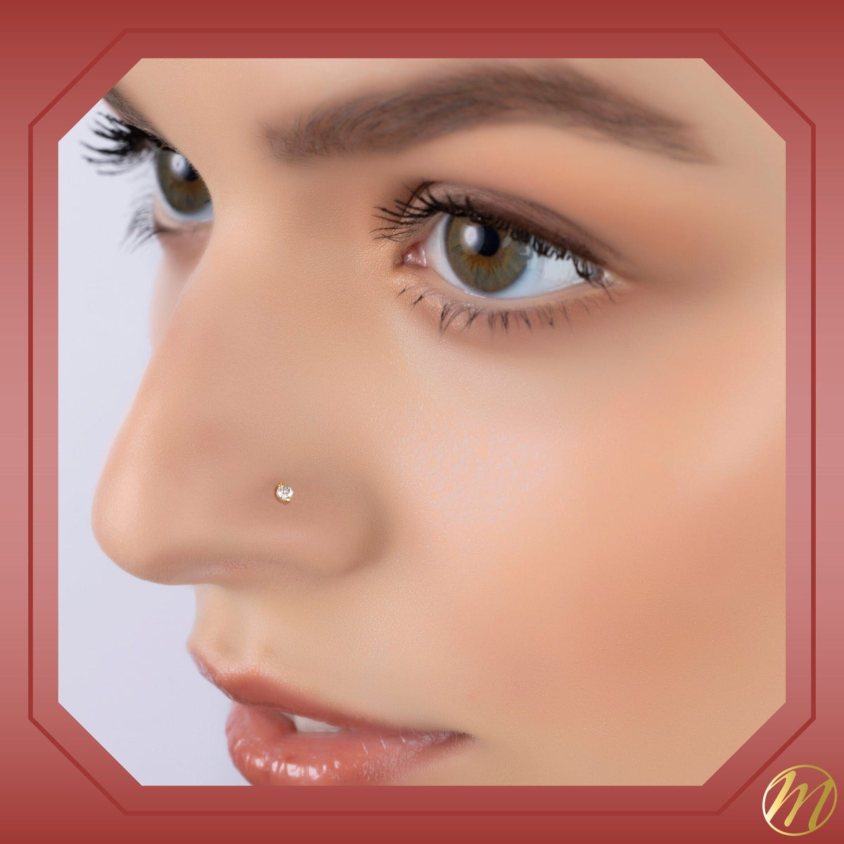 Model wearing 14k yellow gold 2 prong CZ nose stud, 20 gauge by Massete