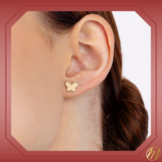 Massete 14k yellow gold matte butterfly stud earrings worn by a model, view 2