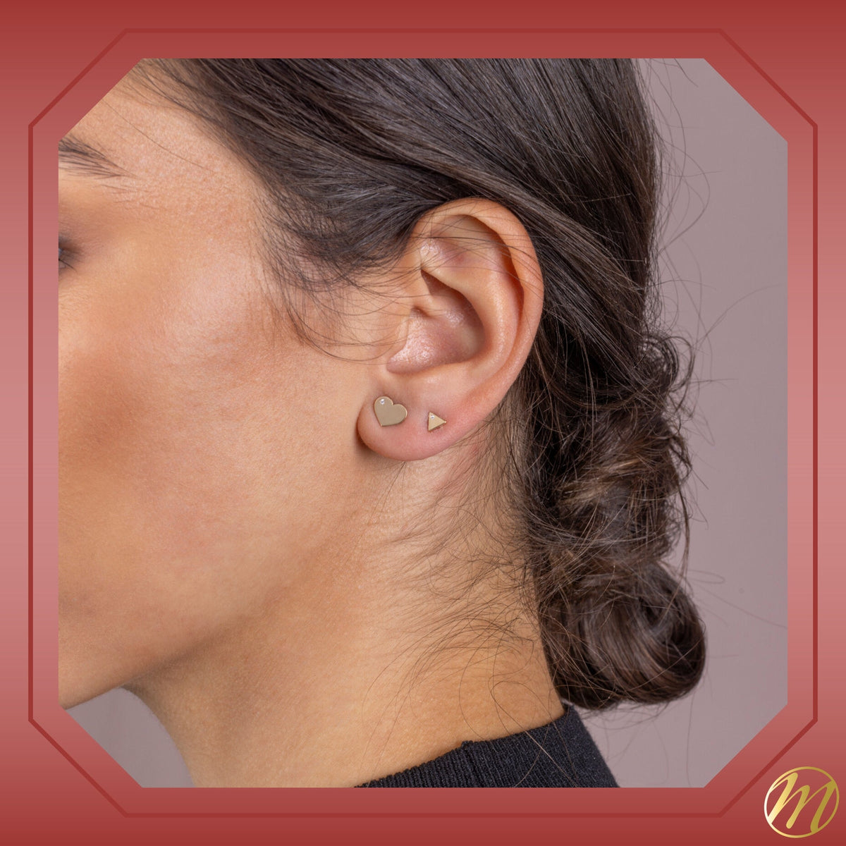 Model wearing 14k yellow gold flat heart stud earrings with CZ by Massete, view 4