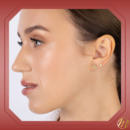 Model wearing 14k yellow gold flat heart stud earrings with CZ by Massete