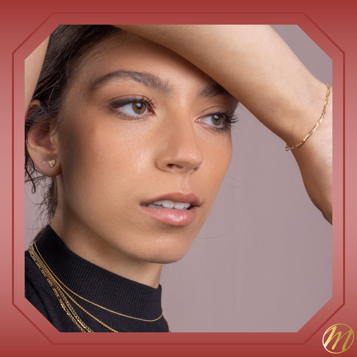 Model wearing 14k yellow gold fluted heart stud earrings with simulated diamond center by Massete, view 5