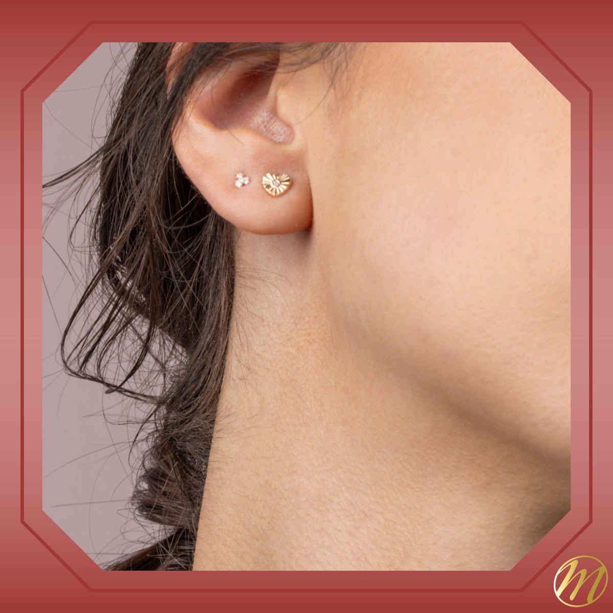 Model wearing 14k yellow gold fluted heart stud earrings with simulated diamond center by Massete, view 2