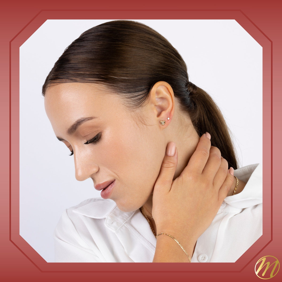 Model wearing 14k yellow gold fluted heart stud earrings with simulated diamond center by Massete, view 6