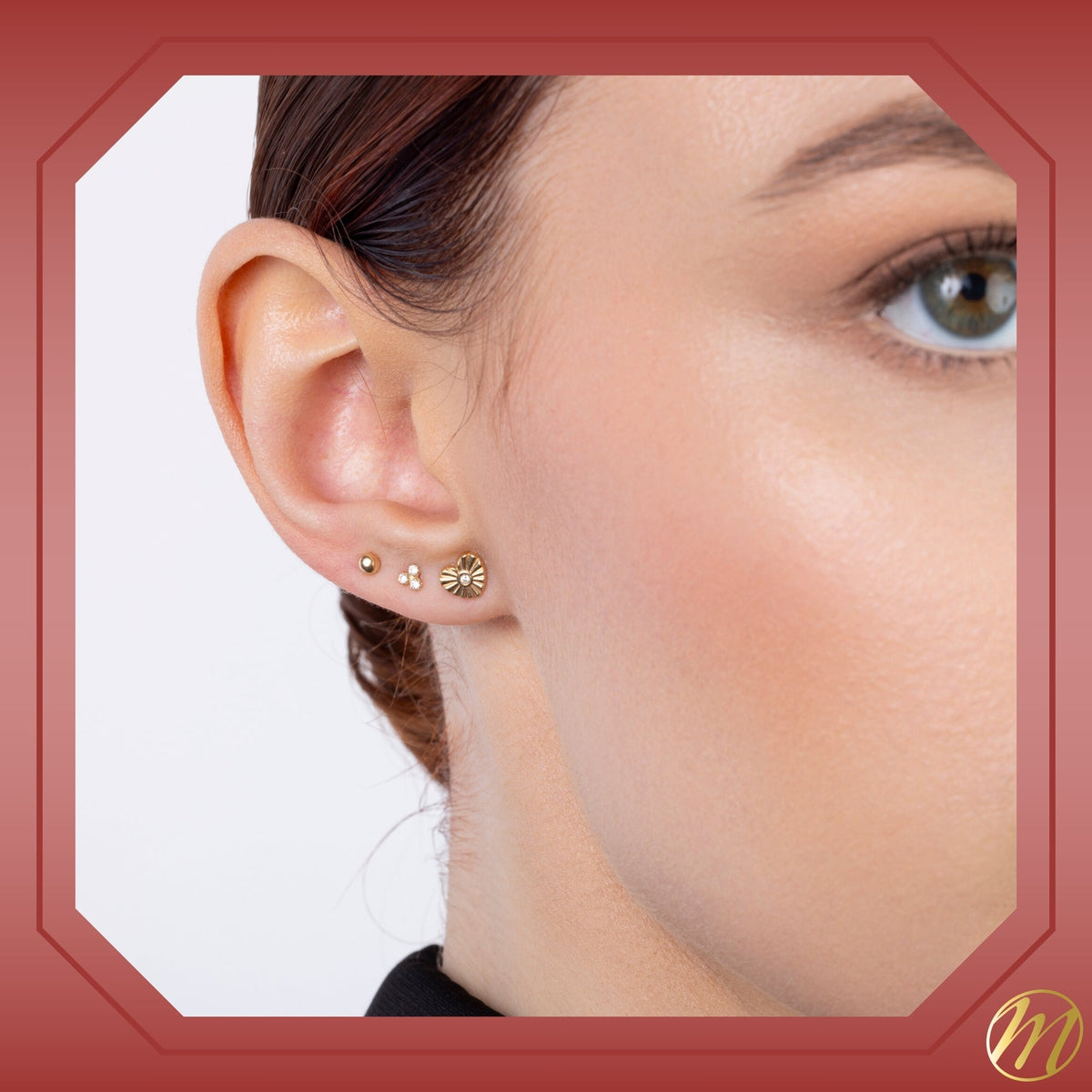 Model wearing 14k yellow gold fluted heart stud earrings with simulated diamond center by Massete, view 4