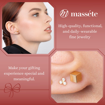 14k yellow gold 4mm cube stud earrings set on an angle by Massete, worn by a model