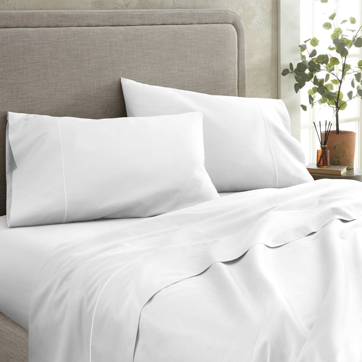 Angle view of Whisper Organics 300 TC organic sateen flat sheet in White