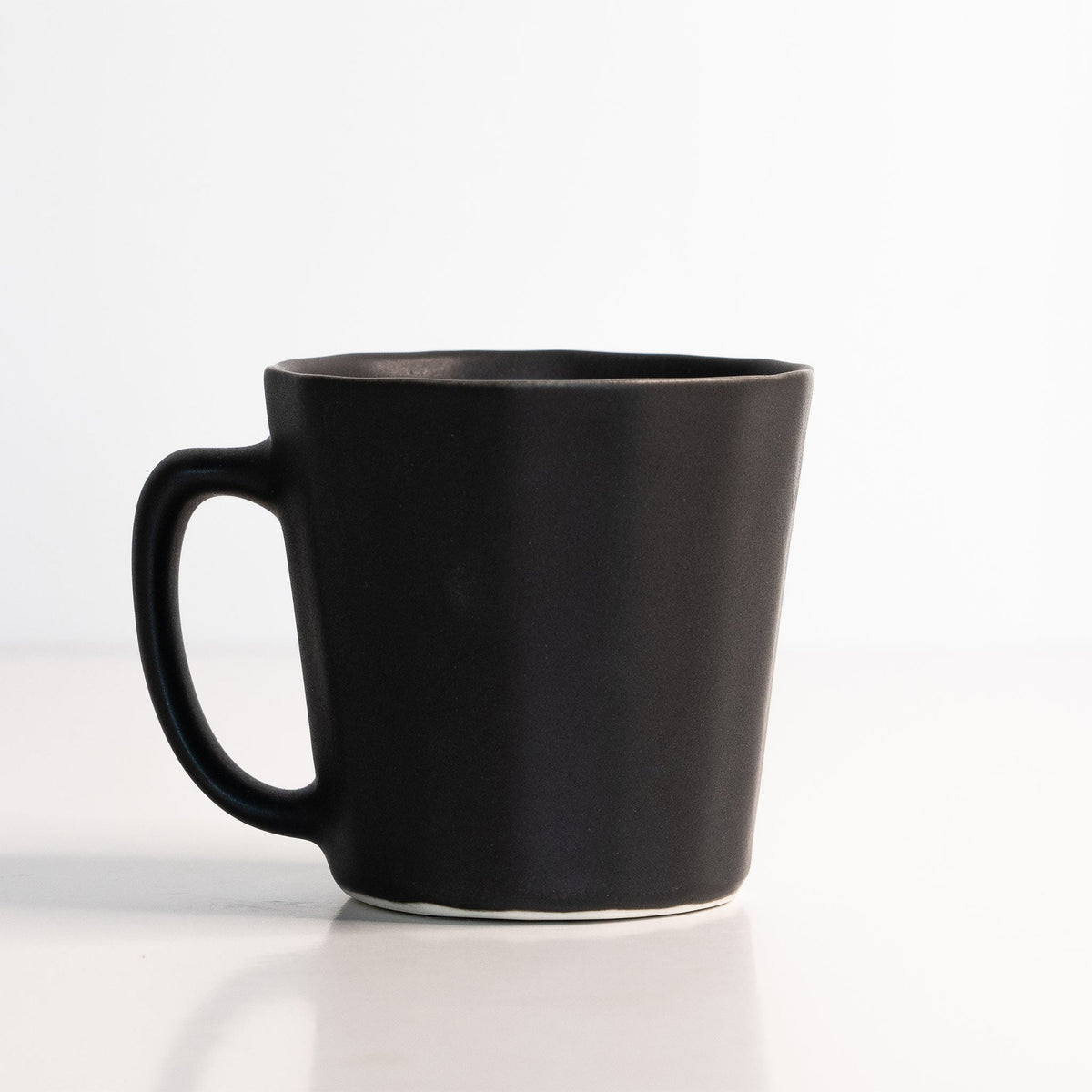 Monday Mug, a handmade oval porcelain coffee cup