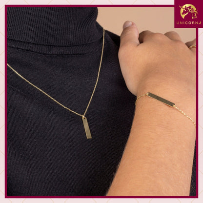 14k yellow gold bar ID bracelet worn by a model, Unicornj, view 2