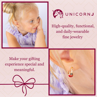 Model wearing 14k yellow gold hoop earrings with red enamel ladybugs by Unicornj