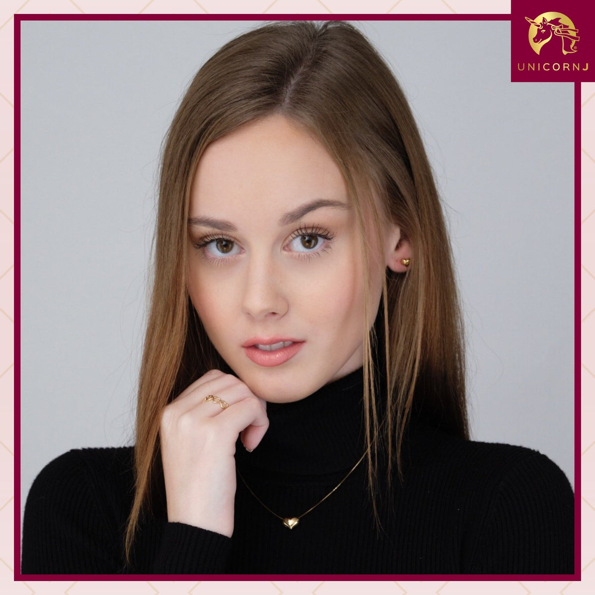 Model wearing 14k yellow gold 6mm puff heart stud earrings by Unicornj, view 3
