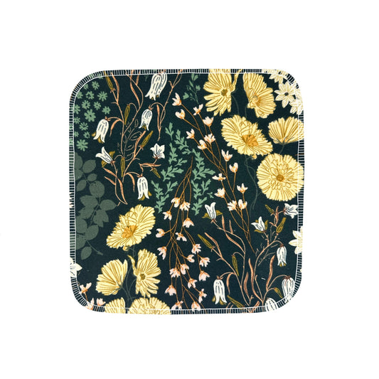 Reusable flannel paper towels with bluebells and buttercups on emerald green