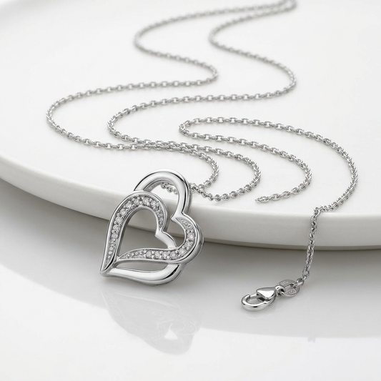 Sterling Silver Dual Heart Motif Pendant with Diamonds (.06 cttw) by Avera Group