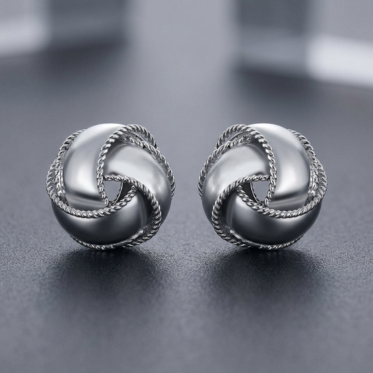 Textured and Polished Love Knot Earrings in Sterling Silver by Avera Group