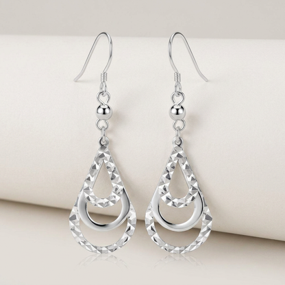 Sterling Silver Textured Graduated Open Teardrop Dangling Style Earrings by Avera Group