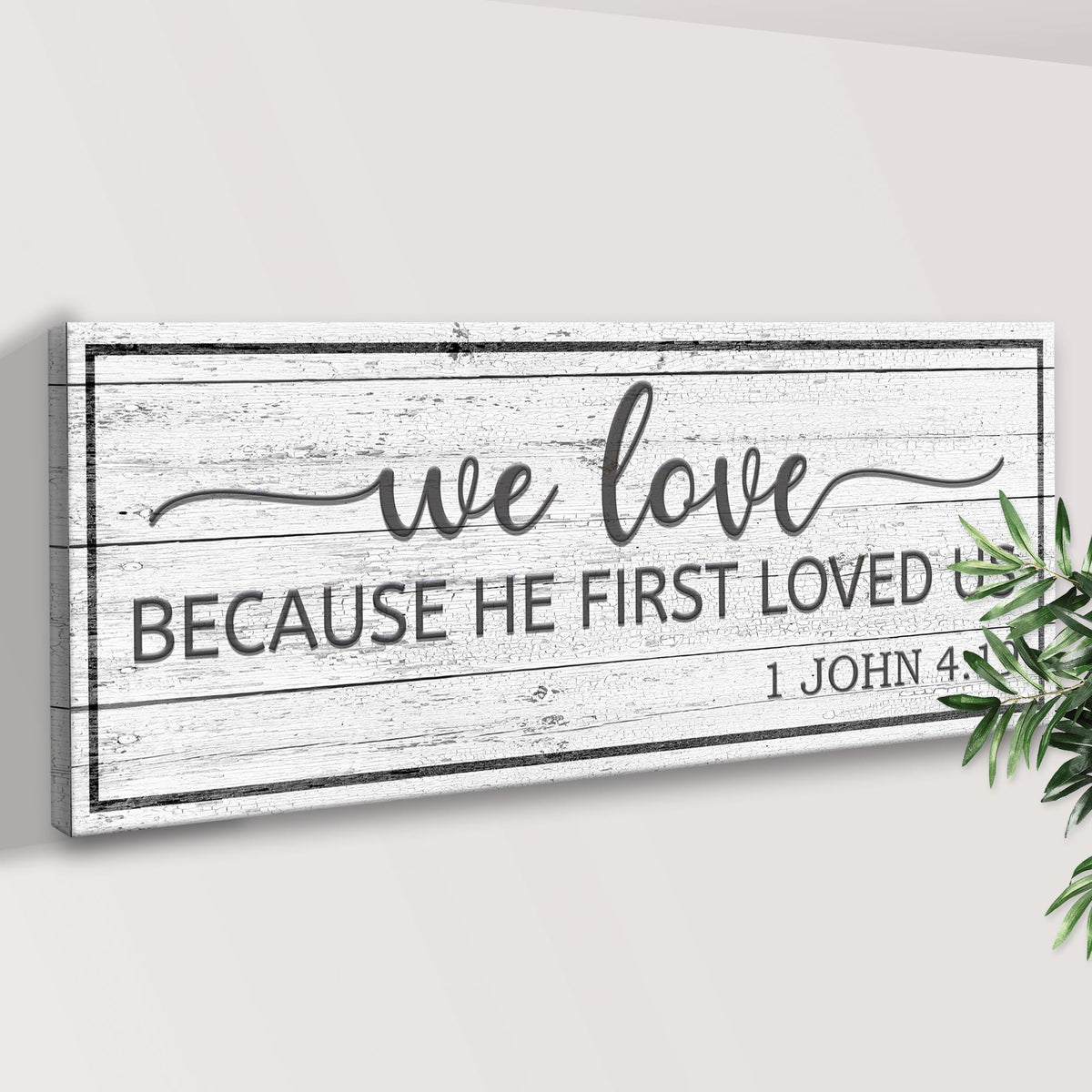 1 John 4:19 Because He First Loved Us canvas by Tailored Canvases shown in a room setting, view 3